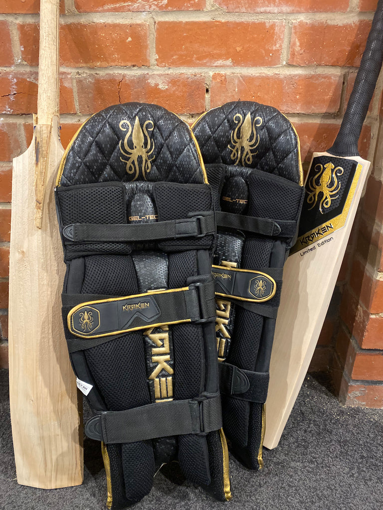 Kraken Cricket black and gold batting pads